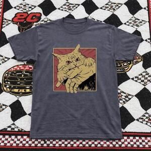 Grey Graphic Tee With A Bold Eye Catching Design Featuring A Cat